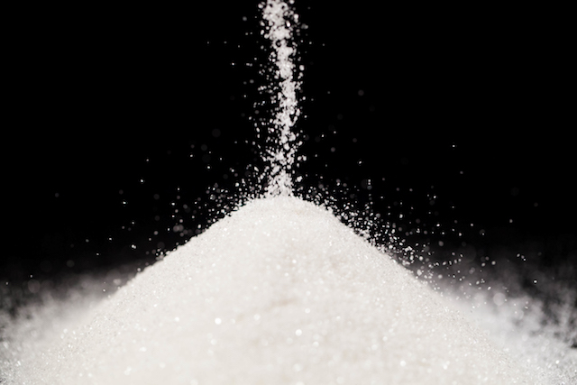 pile of sugar with a black background