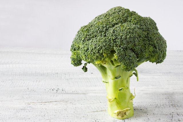 A Broccoli on a table.