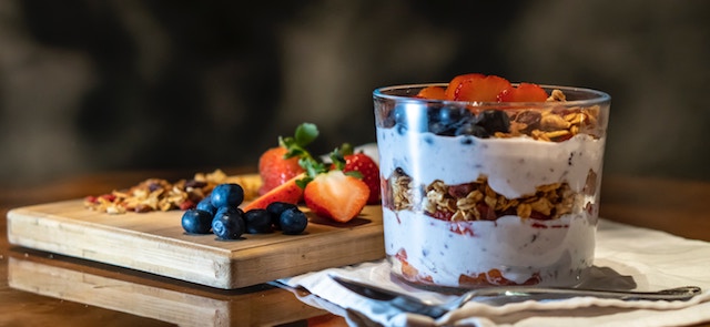 yogurt parfait with fruit and granola. 