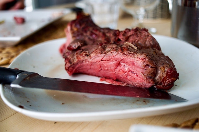 A steak sliced on a plate.
