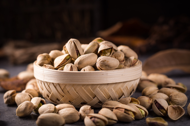 bowl of unshelled pistachios, which are bad to break with your teeth.