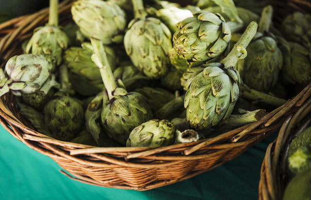 a bowl of fresh artichokes. 